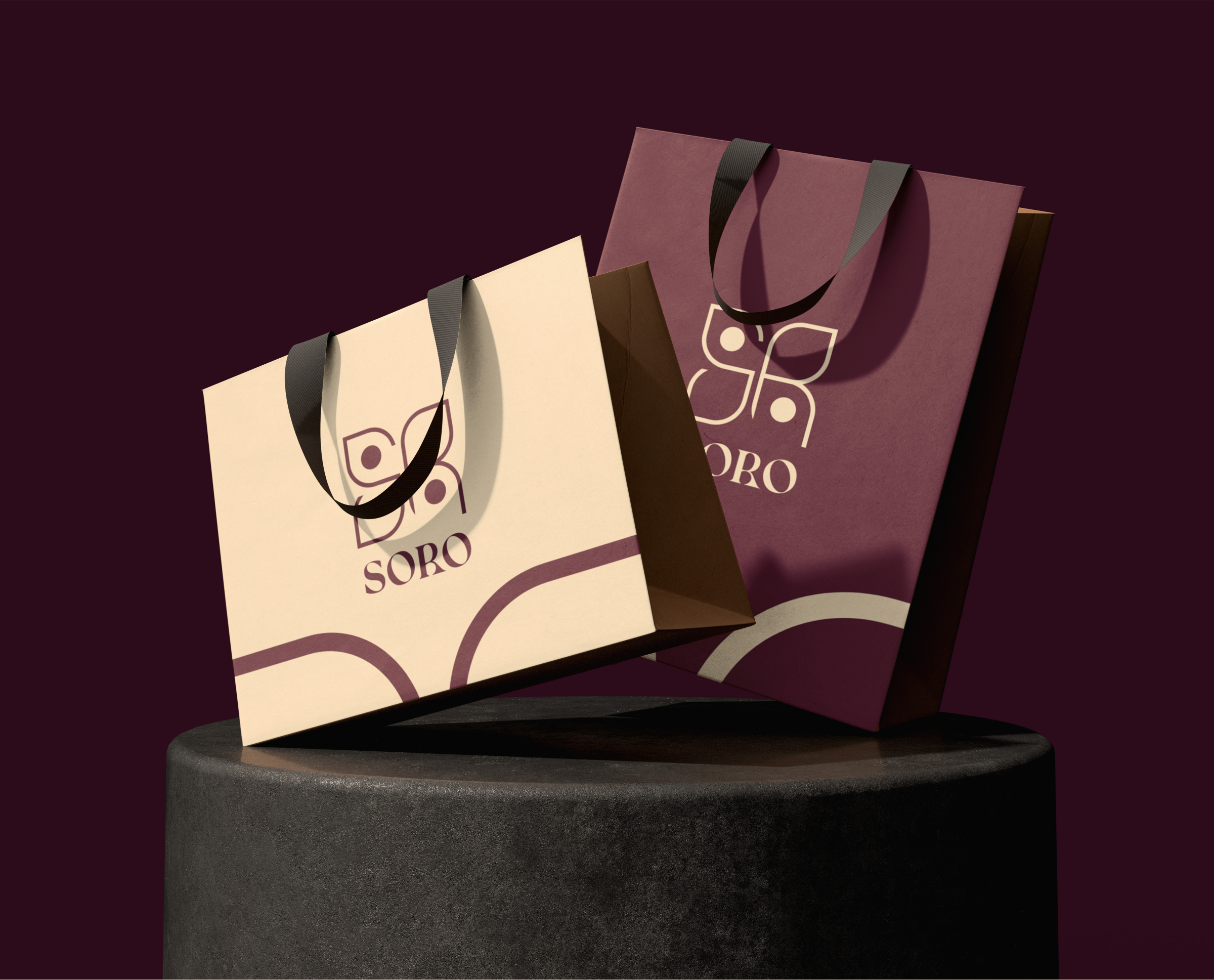 Soro shopping bags in cream and maroon with ribbon handles